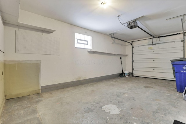 garage featuring a garage door opener