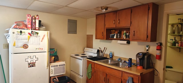 kitchen with a paneled ceiling, sink, white appliances, and electric panel