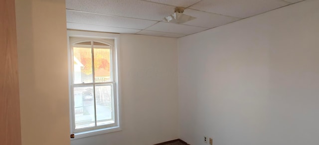 empty room with a drop ceiling