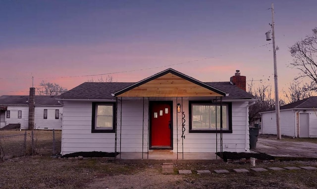 bungalow with a storage shed