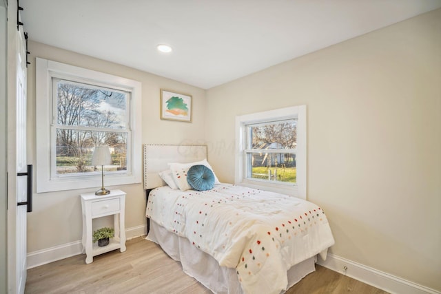 bedroom with light hardwood / wood-style flooring