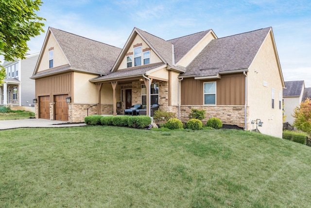 craftsman-style home with a garage and a front lawn