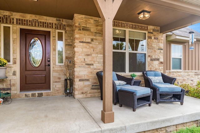 view of exterior entry with covered porch