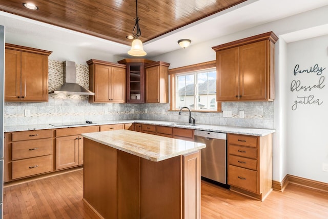 kitchen with wall chimney exhaust hood, sink, light stone counters, a center island, and dishwasher