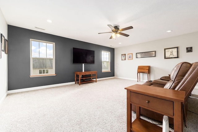 living room with carpet and ceiling fan