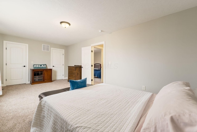 bedroom featuring light colored carpet