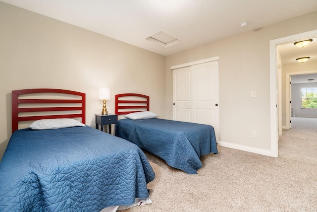 carpeted bedroom with a closet