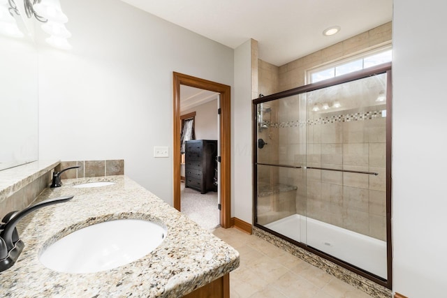 bathroom with vanity and an enclosed shower