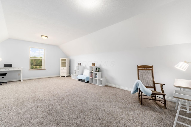 living area with lofted ceiling and carpet flooring