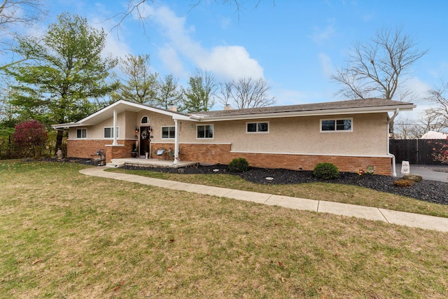 single story home with a front lawn