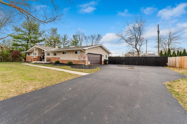 view of front of home featuring a garage and a front yard