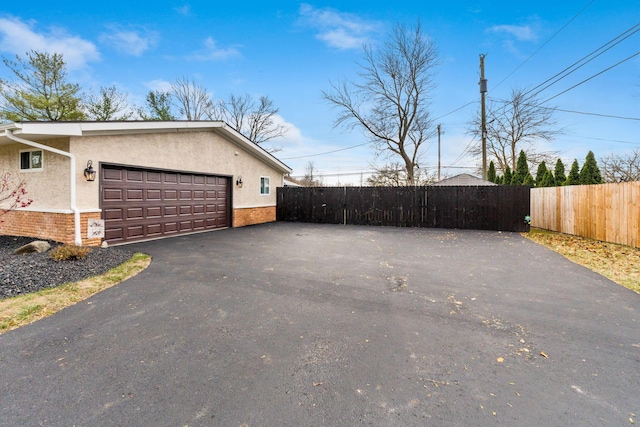 view of property exterior featuring a garage