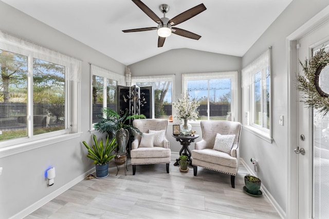 sunroom featuring ceiling fan and lofted ceiling