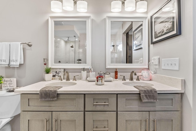 bathroom with a chandelier, vanity, and walk in shower