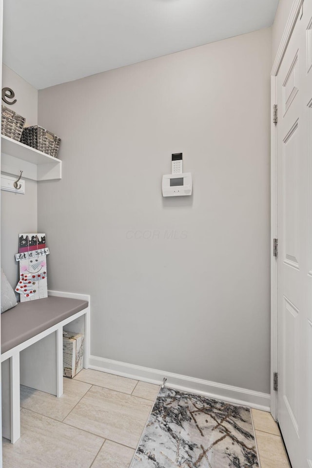 mudroom with light tile patterned flooring