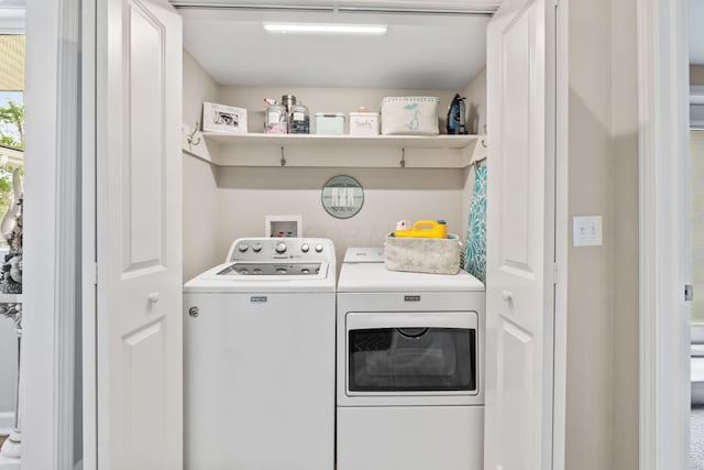 washroom with washer and clothes dryer