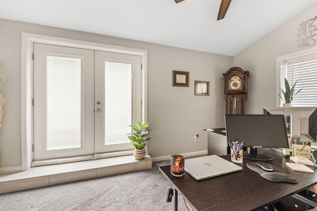 carpeted office with ceiling fan, french doors, and lofted ceiling