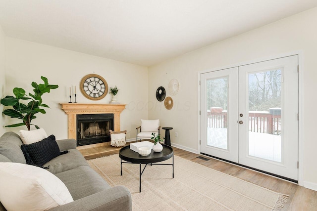 living room featuring light hardwood / wood-style flooring and french doors