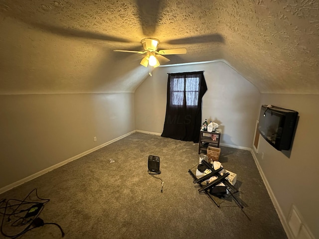 additional living space with a textured ceiling, ceiling fan, vaulted ceiling, and carpet floors