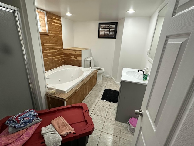 full bathroom featuring toilet, vanity, tile patterned floors, wooden walls, and shower with separate bathtub