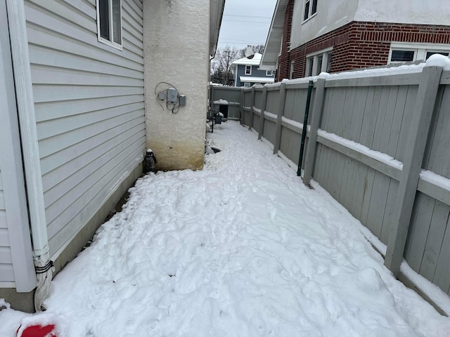 view of yard layered in snow