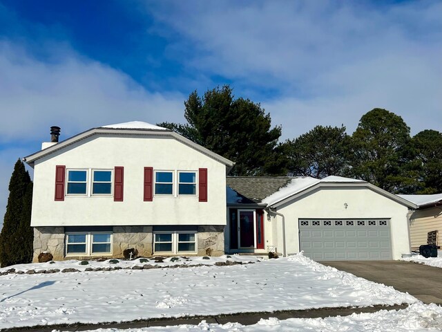 split level home with a garage