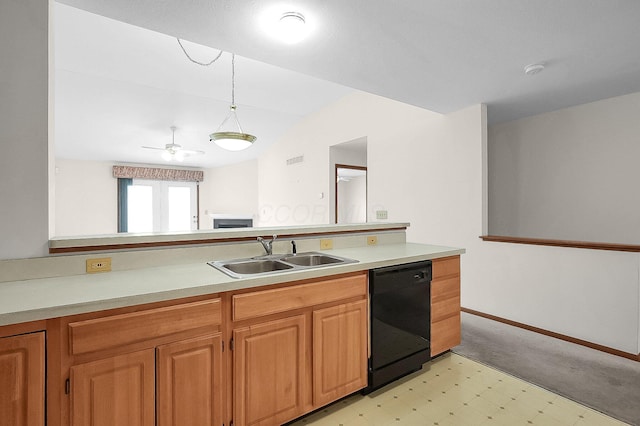 kitchen with vaulted ceiling, pendant lighting, black dishwasher, and sink