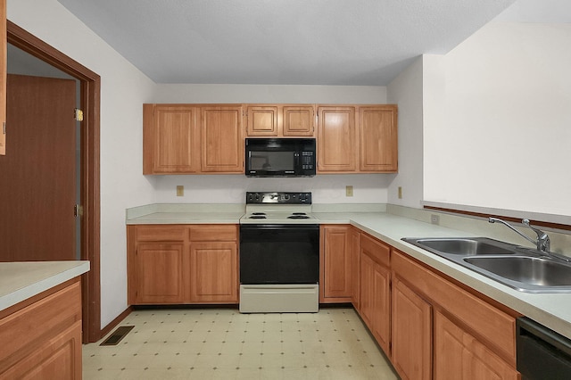 kitchen featuring sink and black appliances