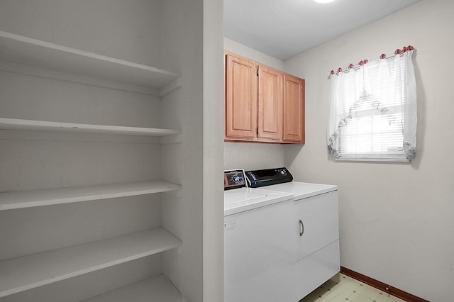 laundry area featuring cabinets and washing machine and dryer