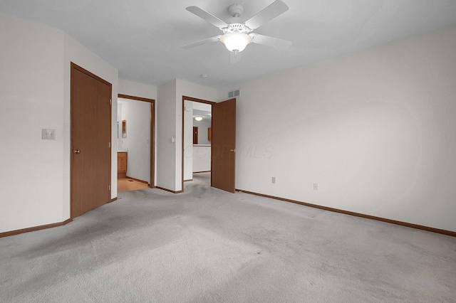 unfurnished room with light carpet and ceiling fan