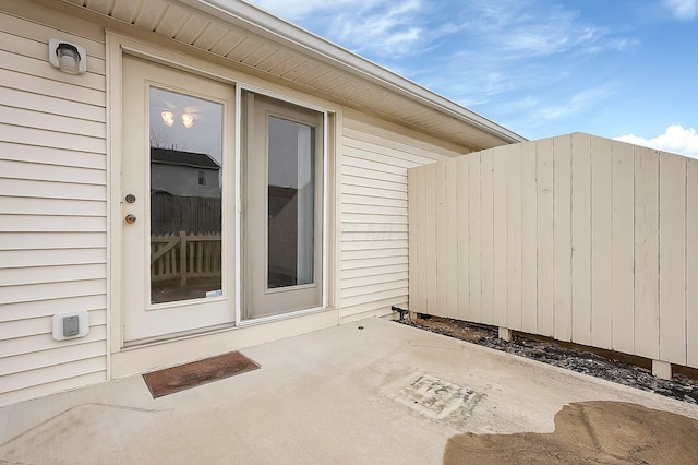 doorway to property with a patio area