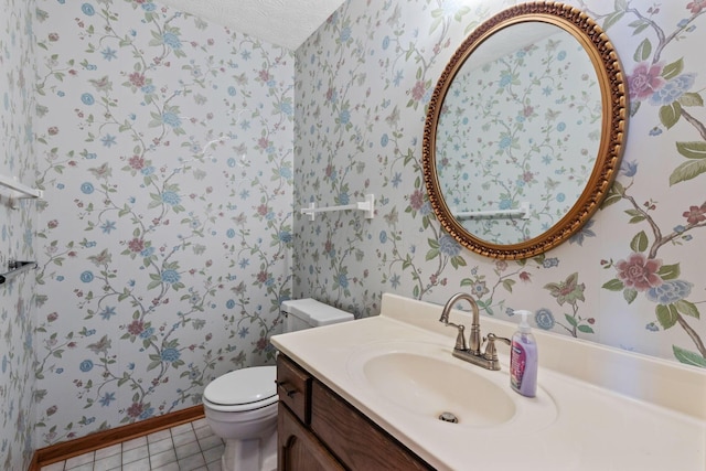 bathroom featuring vanity, tile patterned floors, and toilet