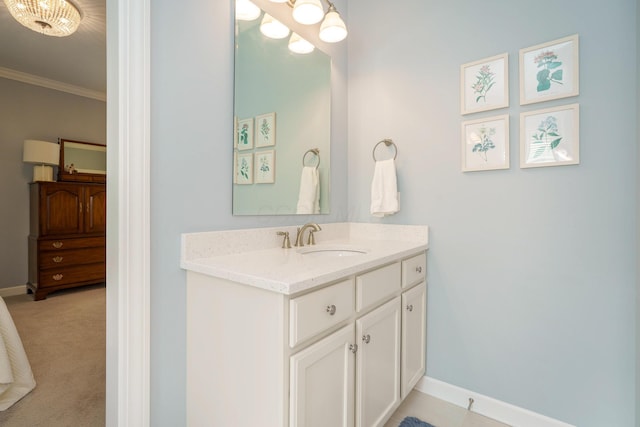 bathroom with vanity and ornamental molding