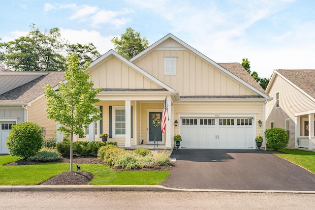 view of front of home with a garage and a porch