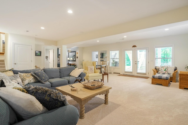 living room with light carpet and french doors