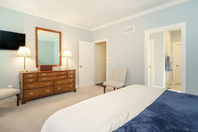 bedroom featuring light carpet, ornamental molding, and ensuite bath