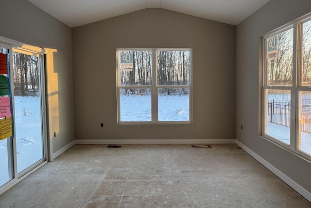 unfurnished dining area with lofted ceiling