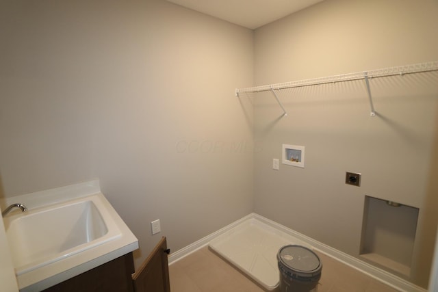 laundry area featuring sink, washer hookup, and hookup for an electric dryer