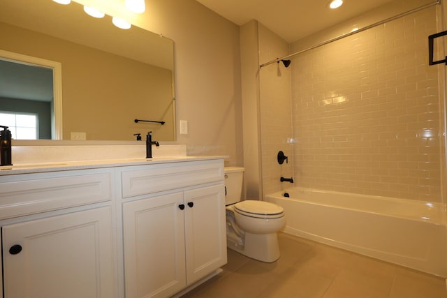 bathroom with tile patterned flooring, washtub / shower combination, toilet, and vanity