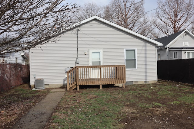 back of property featuring cooling unit and a deck