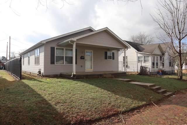 view of front facade with covered porch and a front lawn