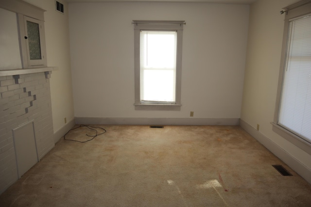 empty room featuring light carpet