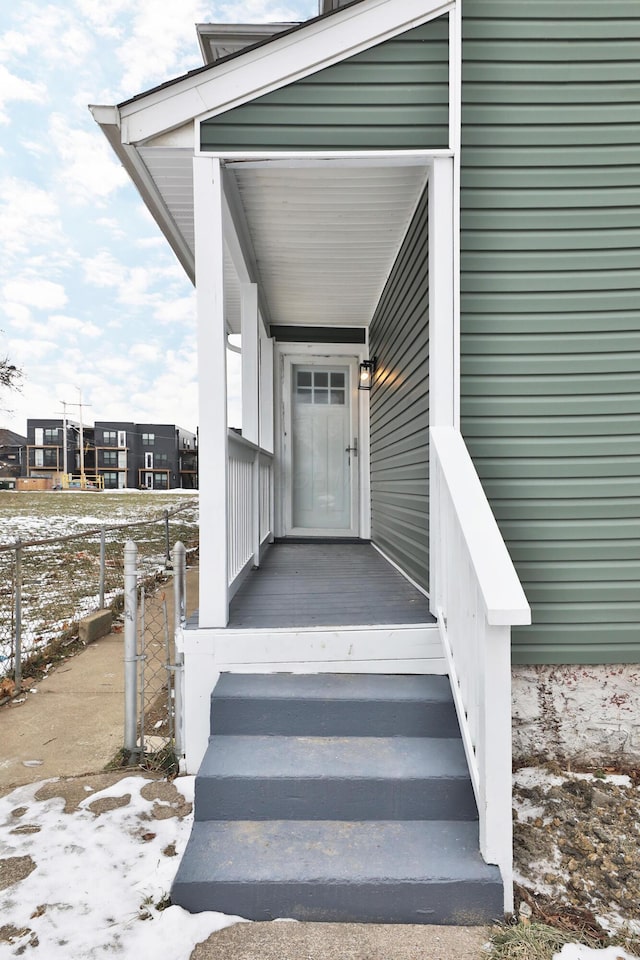 view of snow covered property entrance