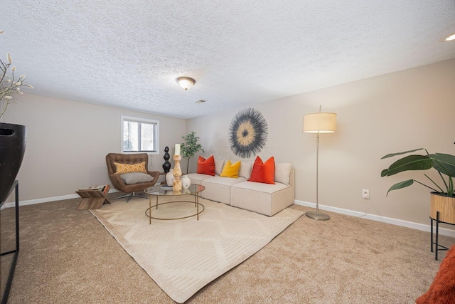 carpeted living room featuring a textured ceiling