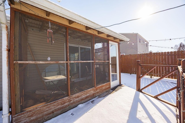 view of patio with a sunroom