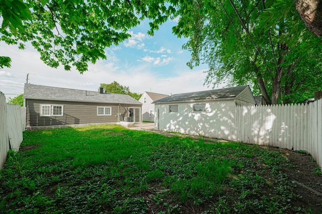 back of house with a yard