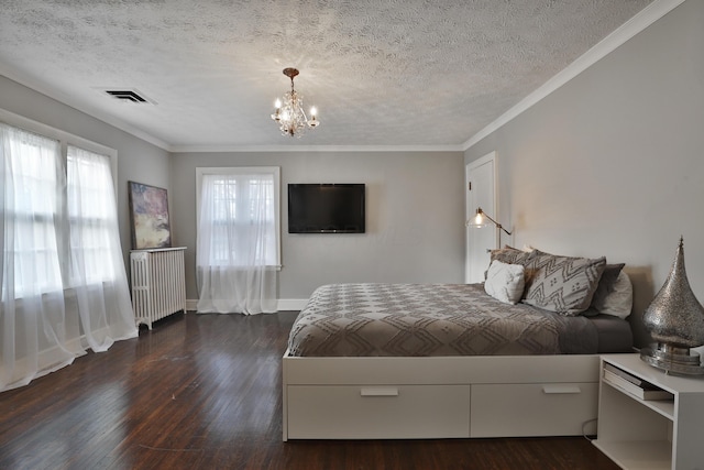 bedroom featuring crown molding, dark hardwood / wood-style flooring, a textured ceiling, and a notable chandelier