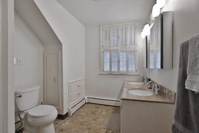 bathroom with vanity, toilet, and a baseboard heating unit