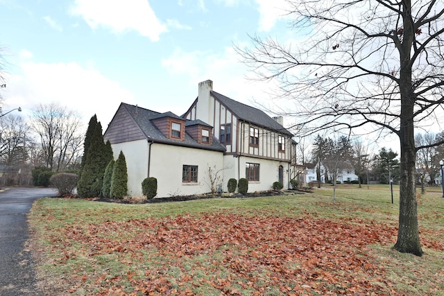 view of home's exterior with a yard