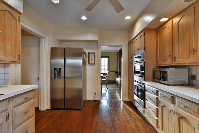 kitchen with decorative backsplash, dark wood-type flooring, ceiling fan, and appliances with stainless steel finishes